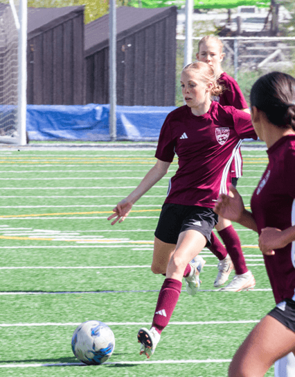 girl playing soccer